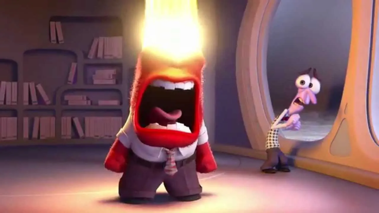 czerwona postać, reprezentująca złość krzyczy na środku biblioteki, a z jej głowy bucha ogień. W tle kuli się szczupła, fioletowa postać