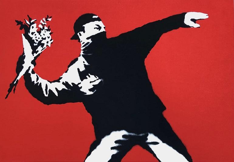 „Love is in the Air" i inne prace Banksy'ego wylicytowane za prawie milion dolarów